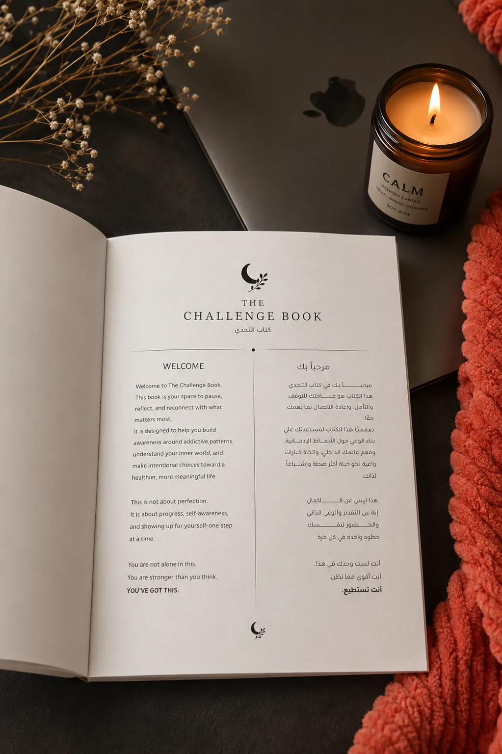 The Challenge Book open to the welcome spread in English and Arabic